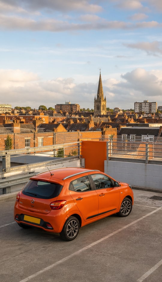 Orange car parked on a rooftop city car park